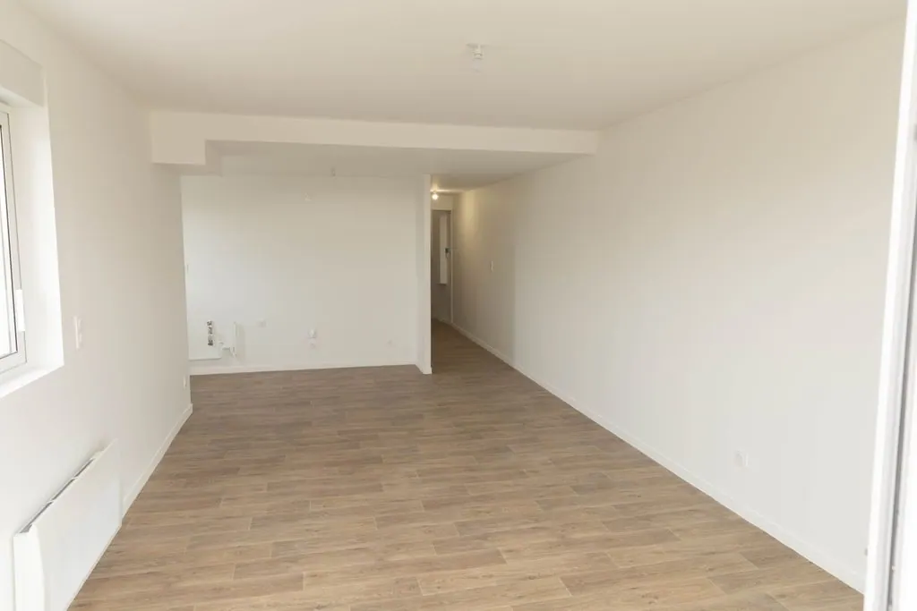 Le séjour, ouvert sur l'extérieur, Appartement 08 T2 à Agen